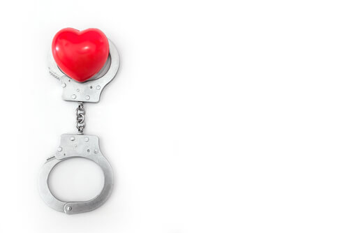 Handcuffs around a heart