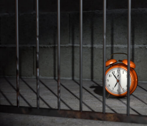 24 hours in jail represented by a clock